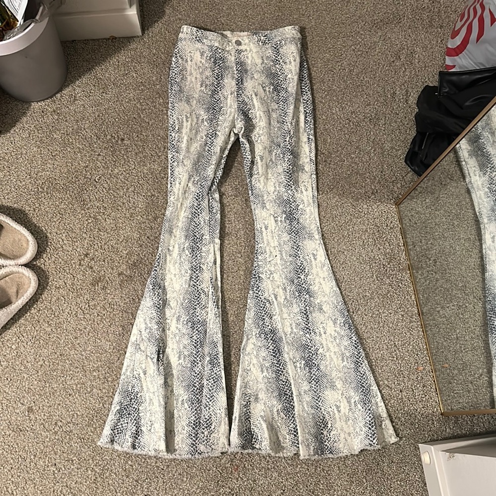 Women’s flared SnakeSkin jeans from Altar’d State